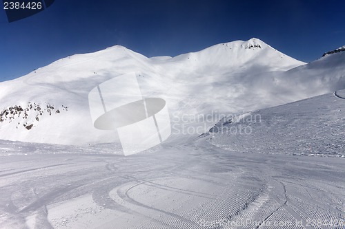 Image of Ski slope with snowmobile trail