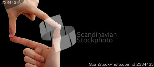 Image of White hand on black