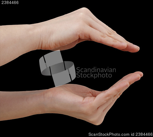 Image of White hand on black