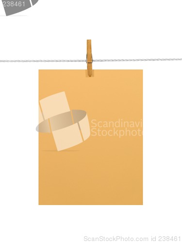 Image of Orange paper sheet on a clothes line (+2 clipping paths)