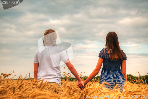 Image of Couple staying at a wheat field