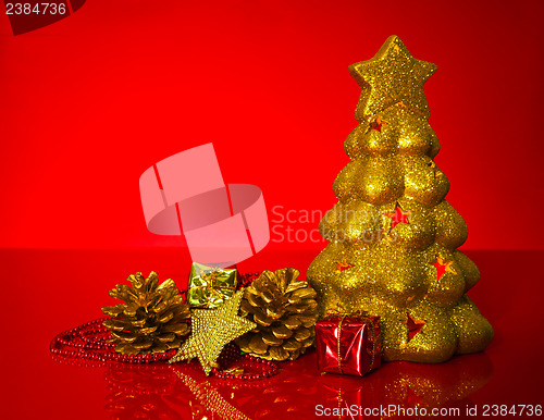 Image of Golden evergreen with Christmas decorations