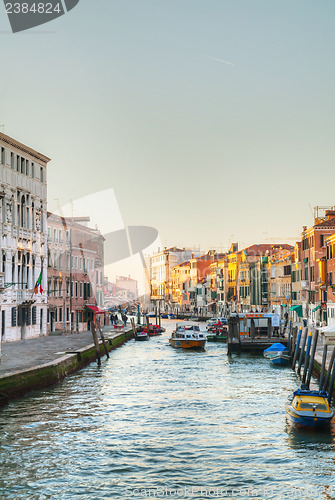 Image of View to a canal from a bridge at sunset