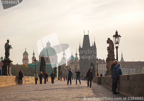 Image of Charles bridge early in the morning with tourists 