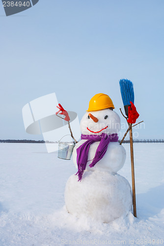 Image of Lonely snowman at a snowy field