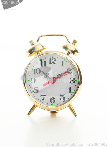 Image of Golden retro style alarm clock