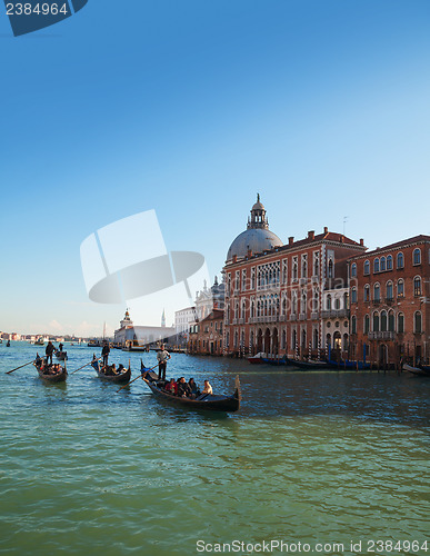 Image of Gondolas with tourists at Grand canal in Venice