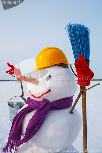 Image of Lonely snowman at a snowy field