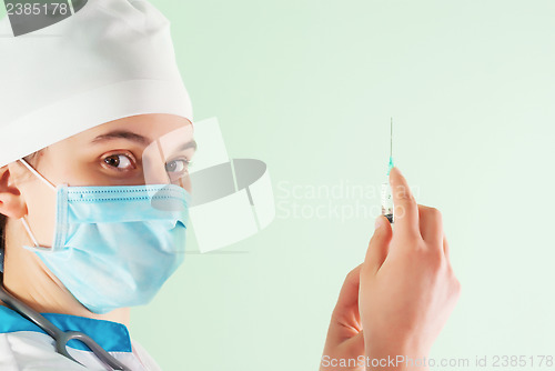 Image of Young lady doctor with syringe