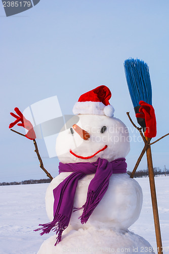 Image of Lonely snowman at a snowy field