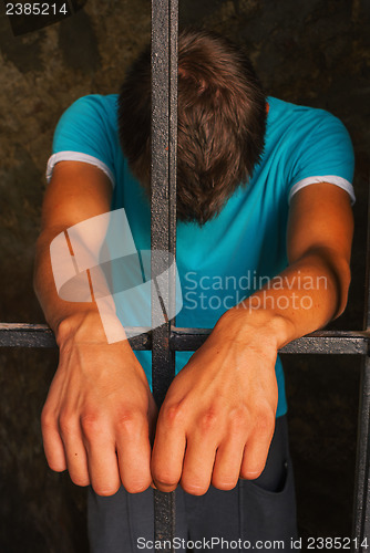Image of Man behind the bars