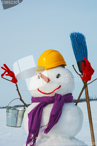 Image of Lonely snowman at a snowy field