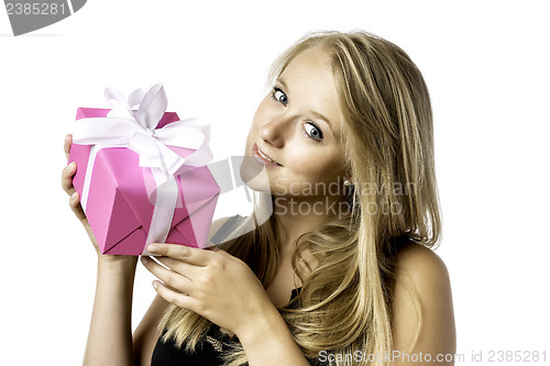 Image of Pretty blond young girl with a present