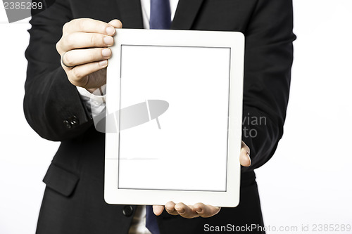 Image of Business man shows his blank tablet computer
