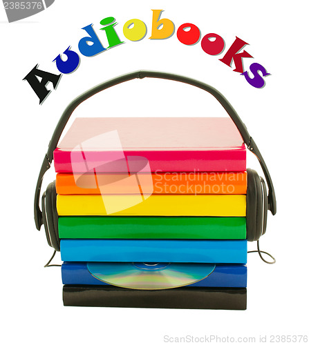 Image of Stack of books and headphones - Audiobooks concept