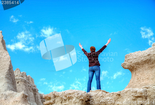 Image of Woman with raised hands