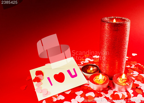 Image of St. Valentine's day greeting background with four burning candle