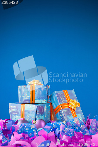 Image of Christmas presents against blue background