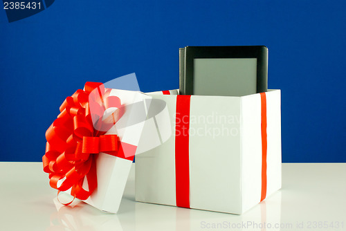 Image of Electronic book reader in a box against blue background