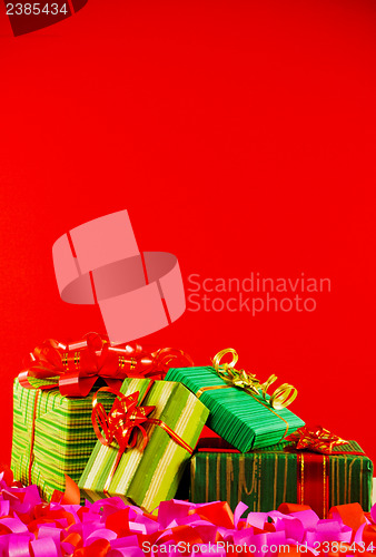 Image of Wrapped boxes with presents against red background