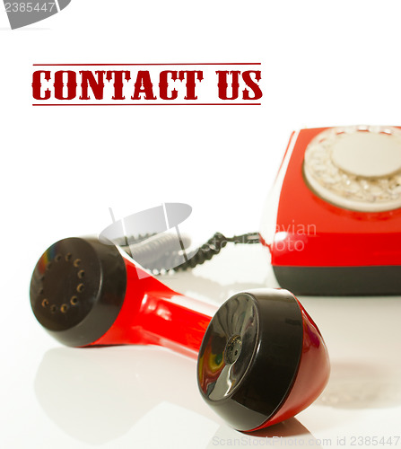 Image of Red old fashioned telephone - Contact us concept