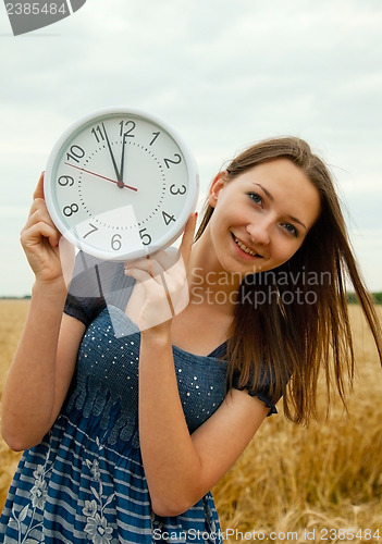 Image of Teen girl holds watches