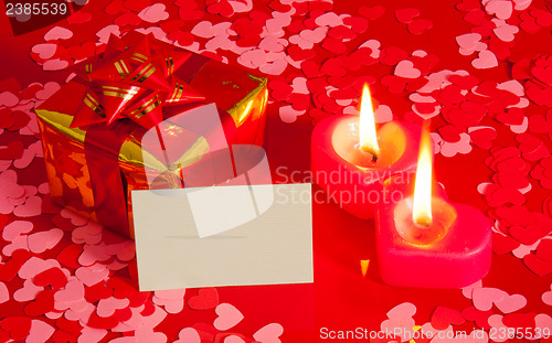 Image of Present and two heart shaped candles with blank card