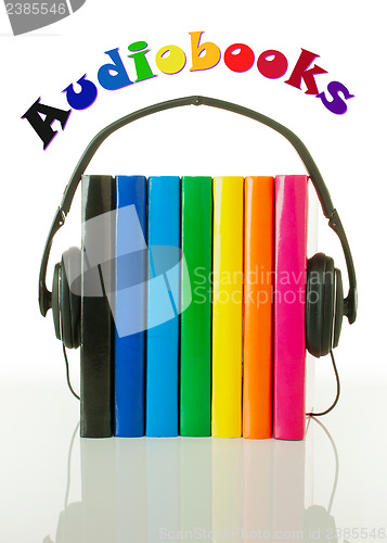 Image of Row of books and headphones - Audiobooks concept