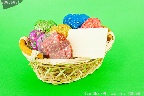 Image of Basket full of the colorful heart shaped toys