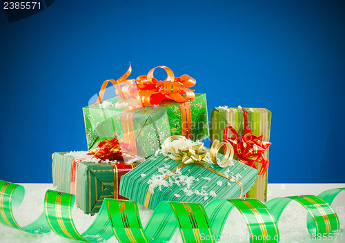 Image of Christmas presents against blue background