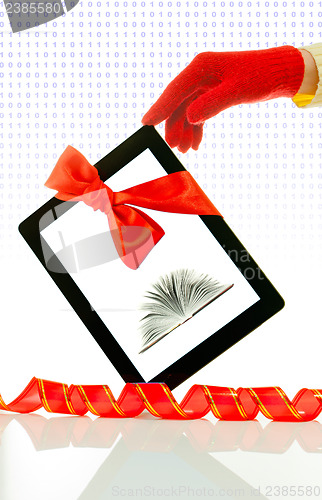Image of Hand wearing red gloves holding a tablet PC