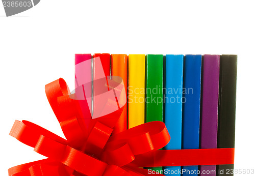 Image of Row of colorful books tied up with ribbon