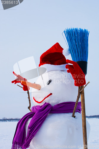 Image of Lonely snowman at a snowy field