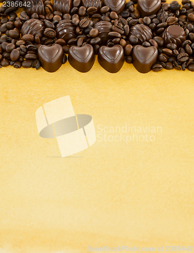 Image of Heart shaped chocolate candies and coffee beans