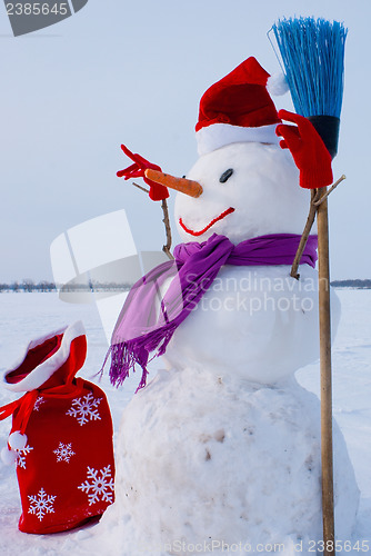 Image of Lonely snowman at a snowy field