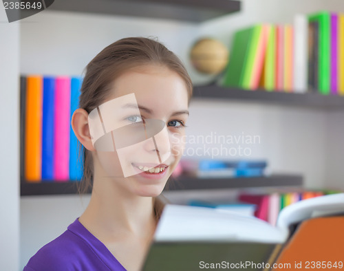 Image of Teenage girl with a book