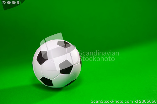 Image of Small soccer ball over green background