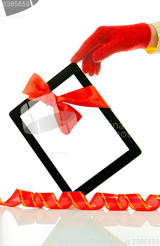 Image of Hand wearing red gloves holding a tablet PC