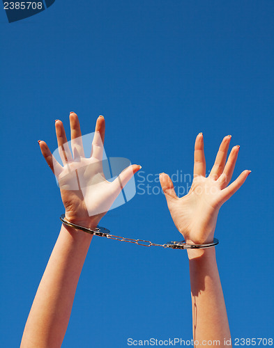 Image of Handcuffed woman's hands