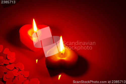 Image of Two burning heart shaped candle