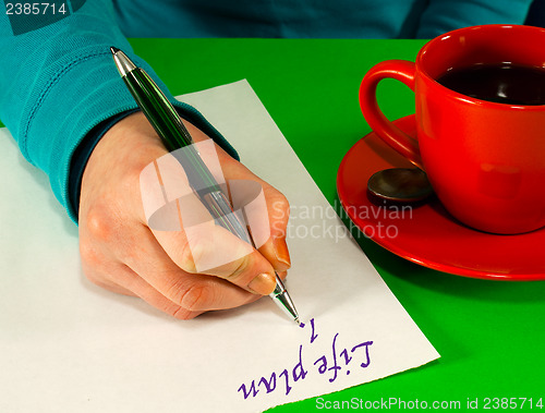 Image of Female's hand writing a life plan