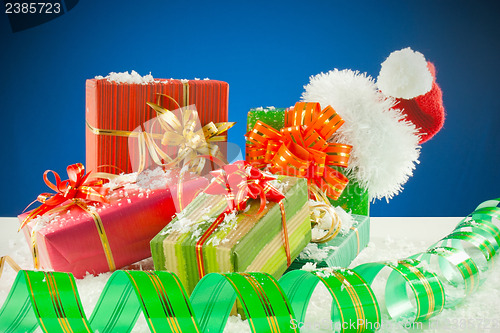 Image of Christmas presents against blue background