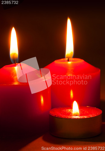 Image of Three burning candles
