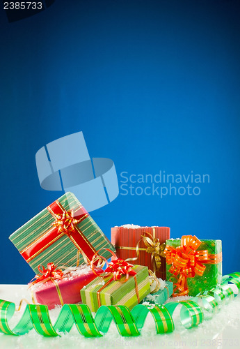 Image of Christmas presents against blue background