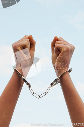 Image of Handcuffed woman's hands