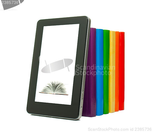 Image of Row of colorful books and tablet PC