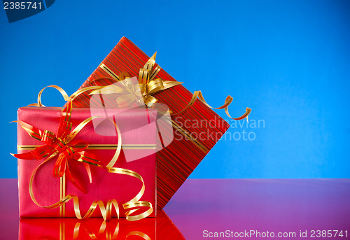 Image of Christmas presents against blue background