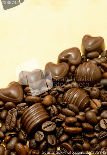Image of Heart shaped chocolate candies and coffee beans