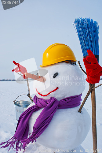 Image of Lonely snowman at a snowy field