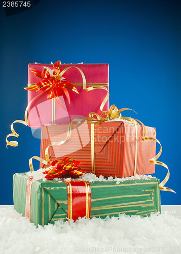 Image of Christmas presents against blue background